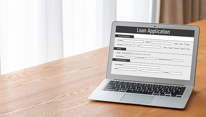 Get a creditbuilder loan Loan application form displayed on a laptop, emphasizing the importance of a strong credit profile for loan approval and financial opportunities.