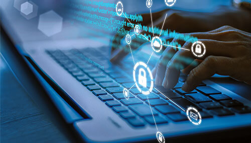 Increase security - tycoonstory | tycoonstory media Close-up of hands on a keyboard with cybersecurity icons, representing the use of advanced call reporting tools for secure business operations.