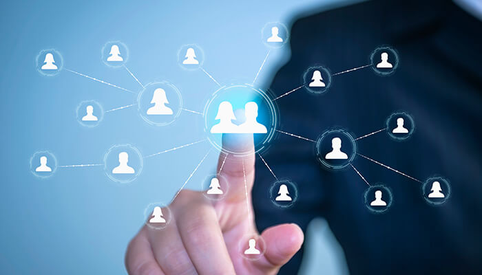 Networking A business professional selecting a digital network icon representing users, symbolizing online certification and virtual learning connections.