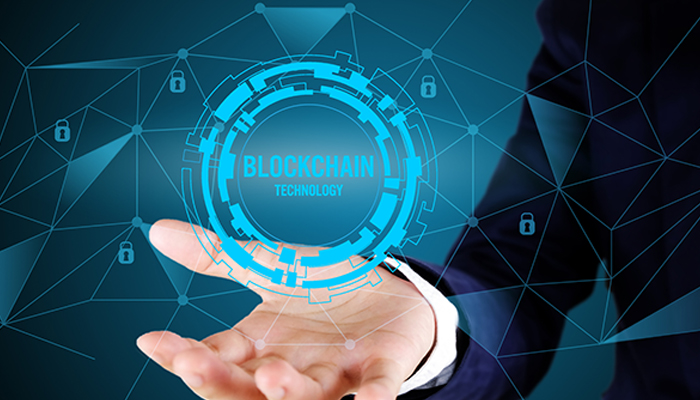 To what end does a blockchain serve Blockchain technology visualized as a glowing digital interface above an open hand, highlighting data security, distributed ledgers, and modern financial innovation.