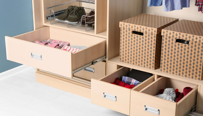 Full-extension drawer slides for your home furniture - tycoonstory | tycoonstory media Closet storage system with open drawers showing full extension drawer slides on wooden cabinetry for organized clothing and accessories