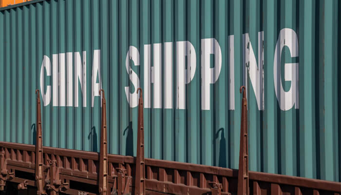 Imports and exports Shipping container marked'China Shipping', symbolizing the impact of COVID-19 on the Chinese economy and global trade disruptions.