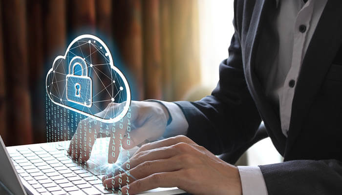 Cloud-based security Cloud-based security shown through a business professional accessing encrypted cloud data on a laptop, highlighting secure online systems and data protection.