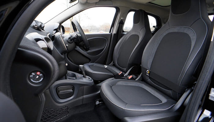 Improved driving experience Interior of a car with focus on comfortable seating, symbolizing red shield administration's vehicle protection plans and their excellent customer service.