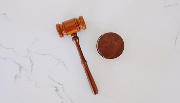 Loan options at barrett-jackson auctions A wooden judge’s gavel on a marble surface, symbolizing financial decisions such as using woodside credit loans to support cash flow management.