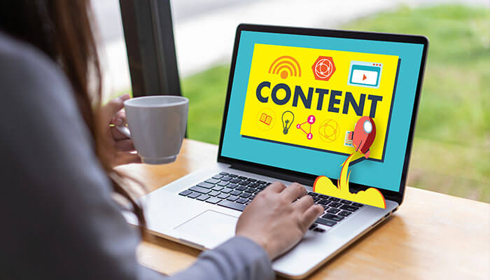 Regularly add fresh content Lead generation through content creation, with a person working on a laptop displaying the word'CONTENT' and various digital icons, symbolizing the process of engaging and attracting potential leads through fresh, engaging content.