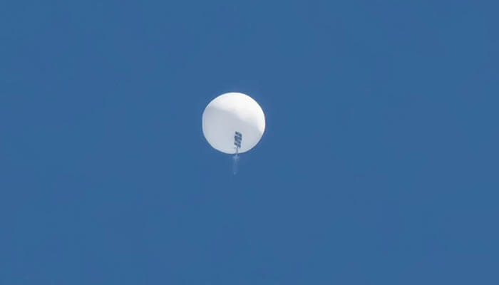The american balloons spying over china in recent times - tycoonstory | tycoonstory media A surveillance balloon involved in balloon espionage, captured in the sky, used for high-altitude monitoring and data collection.