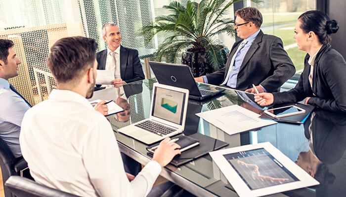 Business in portugal Business in portugal strategy meeting with professionals discussing company formation, planning, and growth