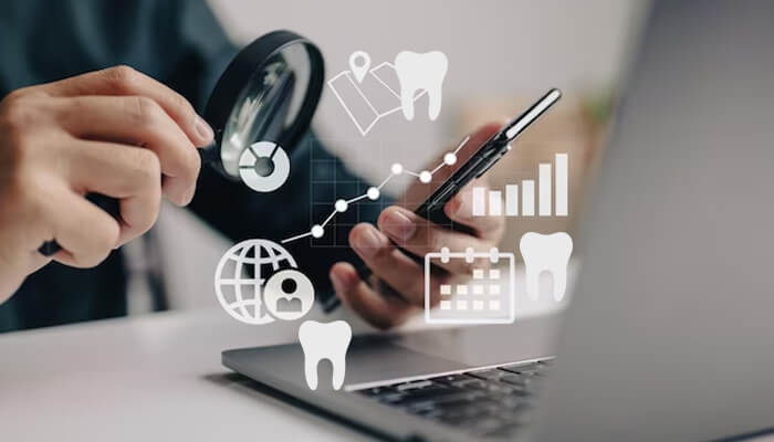 Dental reputation management A person using a smartphone and laptop to manage digital content related to dental care, with icons representing reputation management tools for dental professionals.