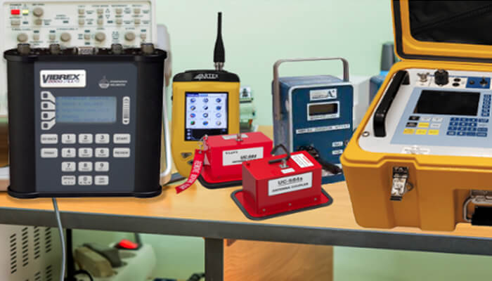 Use a high-quality aviation battery charger Professional battery testing instruments and diagnostic devices arranged on a workbench, used for precision measurement and compliance in aircraft battery testing.
