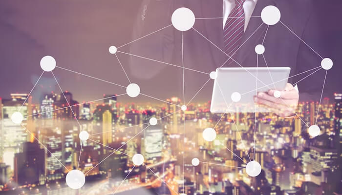 Passion Business executive using digital tablet with global network connection overlay and city lights