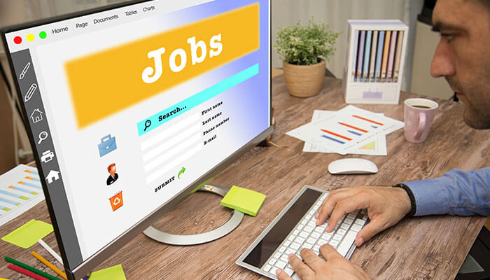 Research jobs Person using a computer to search for jobs, representing the modern approach to job hunting and career opportunities online.