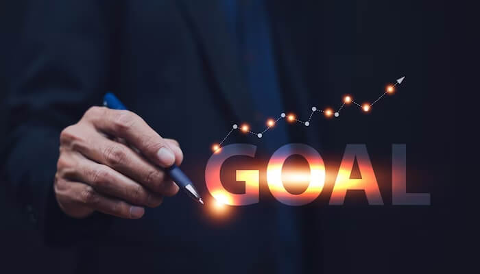 Set your financial goals Business professional setting financial goals with a pen, symbolizing money management and achieving financial success.