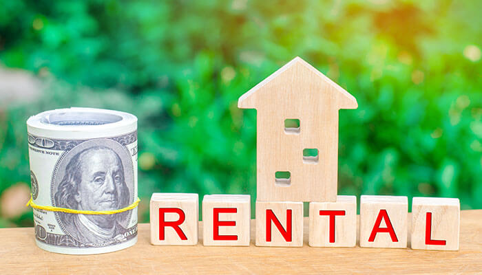 Supercharging your rental property finances Property management software with rental money and house concept