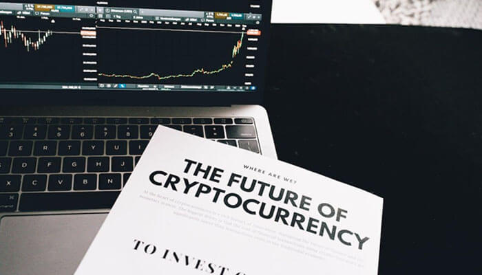 What does this mean for the future of the advertising industry Laptop showing crypto price charts and a report on digital assets, illustrating campaign analytics used by cryptocurrency advertising networks.
