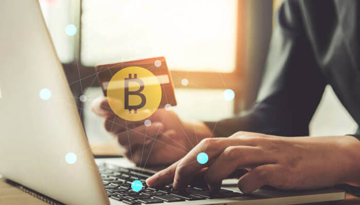 Crypto casino market Person using a laptop for online bitcoin transactions, symbolizing digital payments in the crypto casino market.