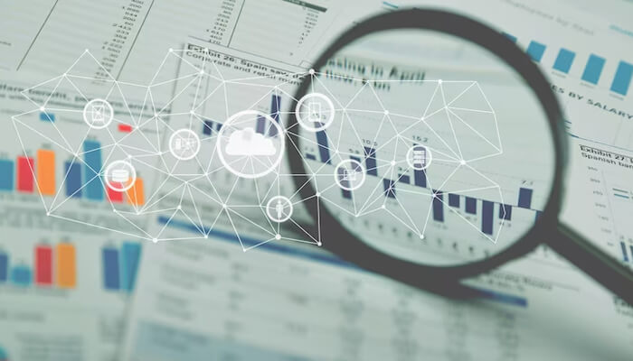 How to conduct effective market research Business analytics dashboard with charts and data networks under a magnifying glass, representing data analysis and strategy for a software startup.
