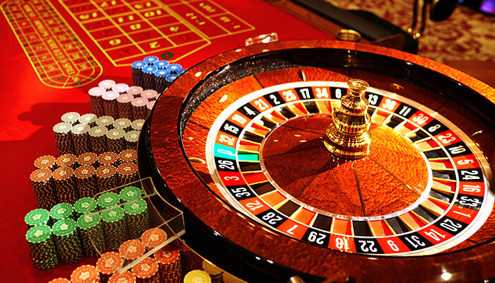 Roulette Roulette wheel and chips on a casino table, representing the thrilling experience at online casinos