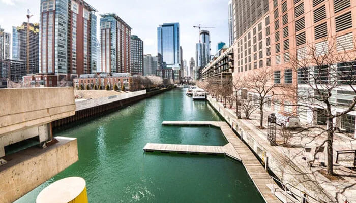 Streeterville Chicago riverfront with modern skyscrapers and docks, showing the urban waterfront and cityscape.