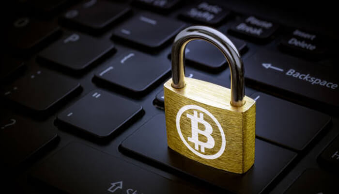 Avalanche vs. Ethereum Bitcoin security padlock on a keyboard representing blockchain safety and network protection considerations in avalanche vs. Ethereum discussions.