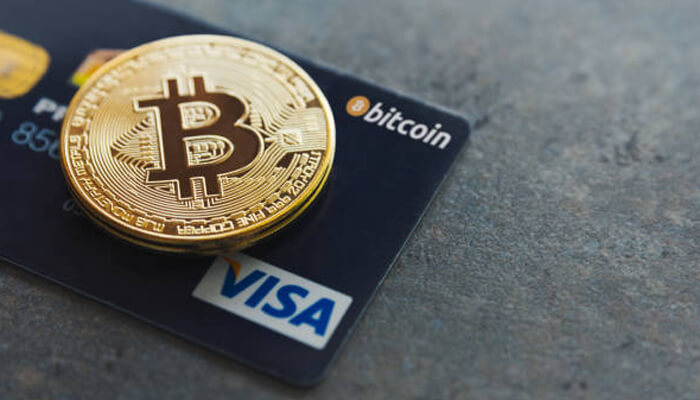 Buying bitcoin with credit cards Buying bitcoin with credit cards illustration featuring a physical bitcoin coin resting on a visa credit card labeled bitcoin.