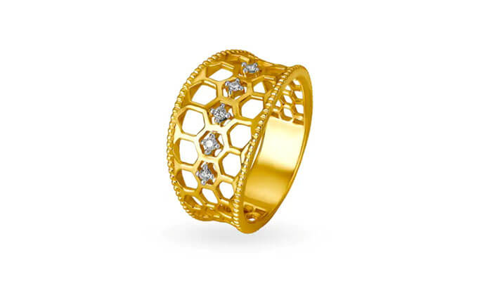 14kt yellow gold diamond finger ring with rectangular design - tycoonstory | tycoonstory media Wide gold band with honeycomb cutout design and diamond accents for a bold statement look.