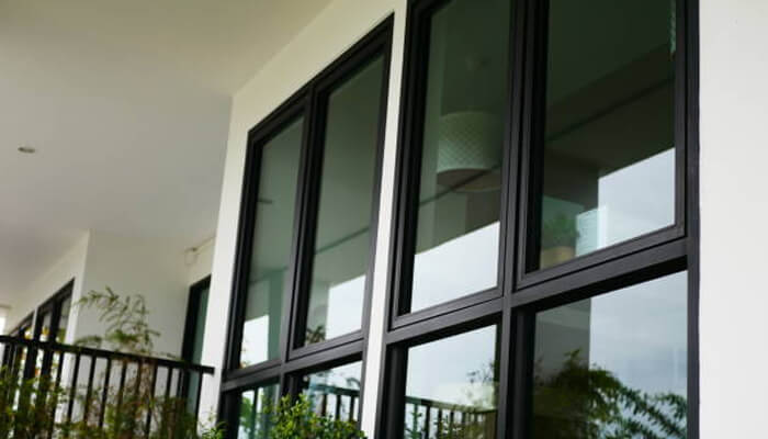 Windows Aluminium windows with sleek black frames, demonstrating the advantages of lesso aluminium windows, known for their durability, modern design, and energy efficiency.