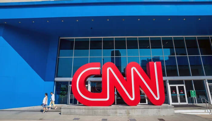 Oil market A wide shot of the cnn headquarters entrance with its iconic large red logo. This visual is often associated with breaking news coverage of global economic shifts, including reports on international trade and the oil market.