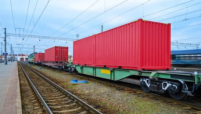 Rail shipping Rail shipping freight containers transported by train at a railway terminal, highlighting eco-friendly logistics, reduced emissions, and sustainable transportation solutions.