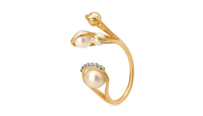 Mia everyday essentials by tanishq 14kt yellow gold finger ring - tycoonstory | tycoonstory media Open gold ring with pearls and tiny diamonds, crafted in a contemporary feminine jewelry style.