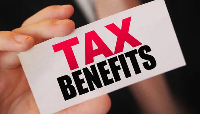 Significant tax benefits - tycoonstory | tycoonstory media Hand holding a card showing tax benefits available when you start a business in texas.