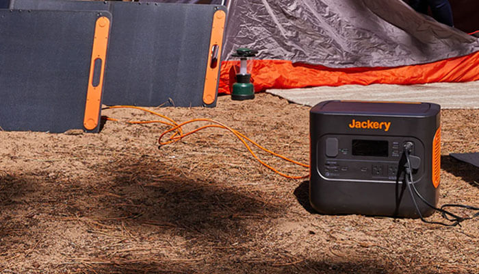 Tips for selecting the right solar charger or generator for outdoor use Solar chargers and generators powering a camping setup with foldable solar panels—perfect for eco-friendly outdoor living.
