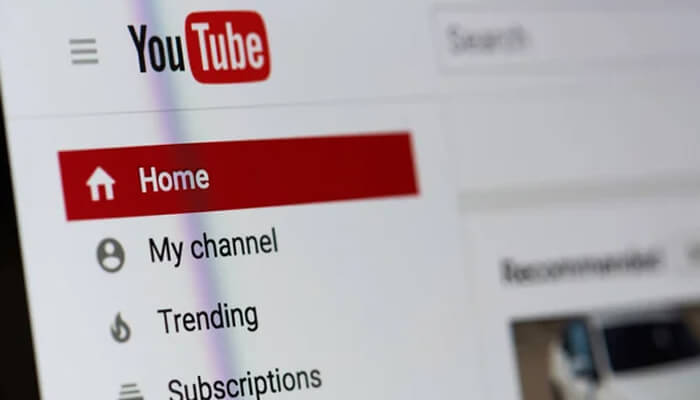 Youtube channel Close-up of the youtube homepage showing the menu options like home, my channel, trending, and subscriptions, symbolizing how to start a youtube channel.