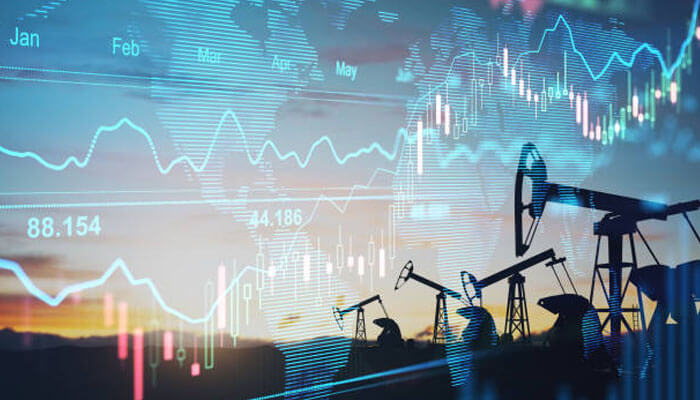 Oil production - tycoonstory | tycoonstory media Oil pump jacks overlaid with financial charts, representing fluctuating oil demand and market trends.