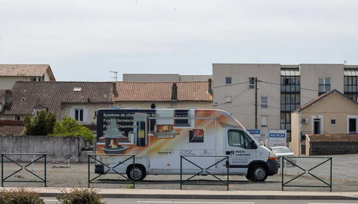 Cost-effective advertising Van wrapped with vinyl advertising for a heating system, illustrating the effective use of vinyl vehicle wraps for business promotions.