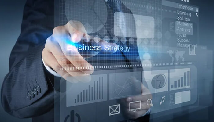 Financial consequences A businessman interacting with a digital interface displaying business strategy and financial metrics, illustrating the impact of financial consequences in decision-making.