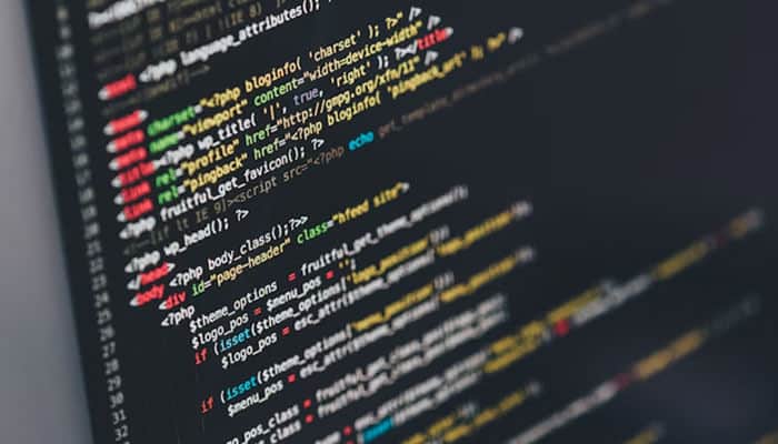 Limited scalability - tycoonstory | tycoonstory media Close-up of programming code on a screen, symbolizing custom development support within a website builder service.