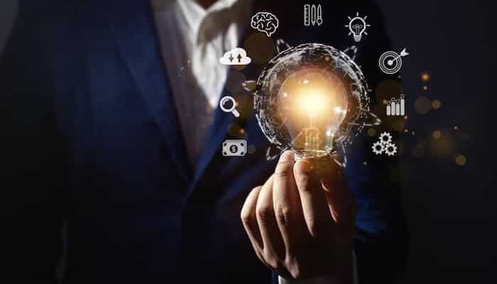 Alex rodriguez Image of a business professional holding a glowing lightbulb, with icons representing innovation and creativity surrounding it. This symbolizes alex rodriguez's innovative thinking and creativity in both his athletic and business ventures under 'Innovation and Creativity.