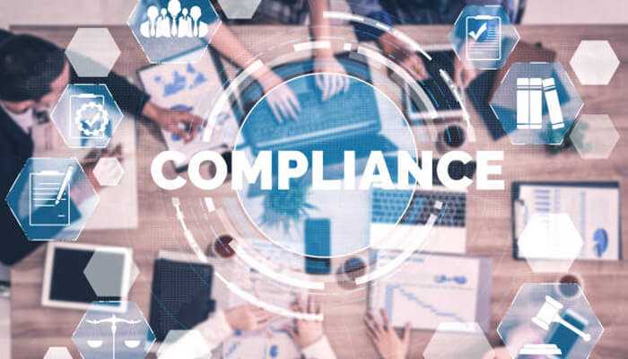 Email signatures Professional meeting with various compliance symbols, showcasing the role of email signatures in maintaining compliance with corporate standards.