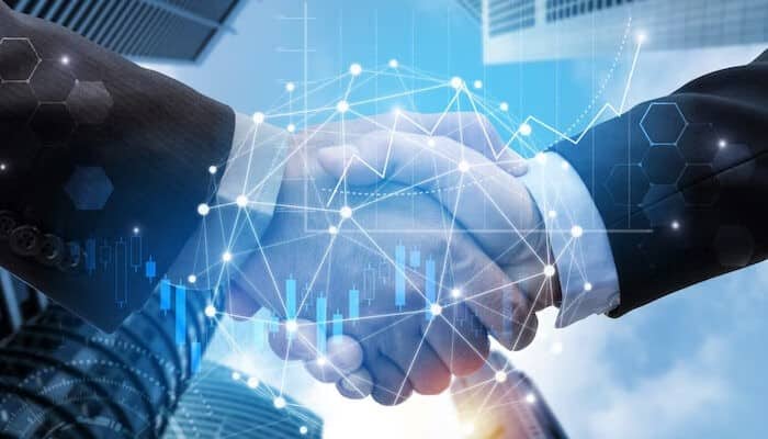 Alex rodriguez Image of two professionals shaking hands with a digital overlay symbolizing strategic networking. This relates to alex rodriguez’s ability to build relationships and connect with successful individuals, creating numerous business opportunities.