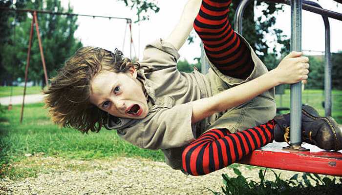 Playgrounds Playgrounds accident awareness image showing a child slipping and falling from playground equipment, highlighting what to do if your child has an accident at the playground and the importance of quick parental response and safety.