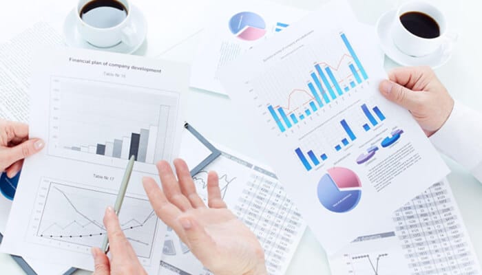 Will the sucess of future hvac businesses hinge on mini splits - tycoonstory | tycoonstory media A professional hvac technician wearing a blue uniform and cap installing clean air filters into a sleek, wall-mounted white indoor unit, part of a high-efficiency mini splits heating and cooling system.