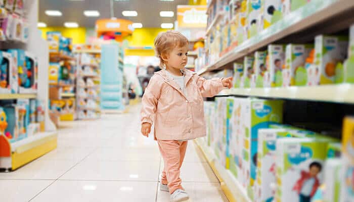 Toy and game Retail toy store aisle showing consumer shopping behavior, commonly used as a visual reference in reports on adult toy sales trends and overall toy industry demand.