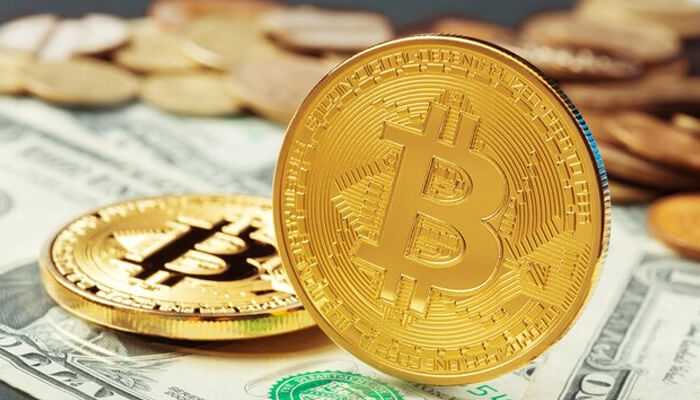 Basic income and bitcoin Basic income and bitcoin synergy illustrated by bitcoin coins placed on paper currency, symbolizing the connection between universal basic income concepts and digital cryptocurrency.