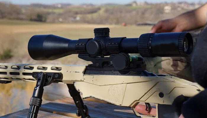 Burris veracity ph - tycoonstory | tycoonstory media Long-range rifle equipped with a mounted scope set up outdoors for target shooting.
