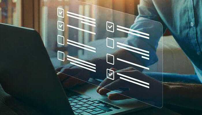 Paid online surveys customer feedback User typing on laptop with digital checklist interface, representing paid online surveys and online earnings.