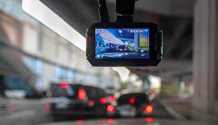 Dashboard-mounted screen recording traffic on the road, showcasing the importance of Vehicle Cameras for safety and monitoring.