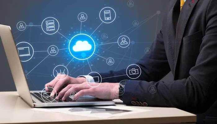 Online faxing A man securely sends confidential documents using an online faxing service on his computer, highlighting enhanced security features such as end-to-end encryption and privacy protections.