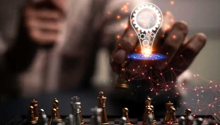 Strategic solutions for complex challenges - tycoonstory 1 | tycoonstory media Nick muzin’s strategic thinking symbolized through a chess game with a lightbulb representing innovation, surrounded by a network of interconnected ideas.