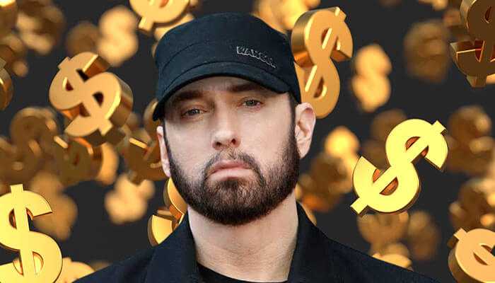 Brand endorsements that increased eminems net worth - tycoonstory | tycoonstory media Eminem striking a serious look in a black cap and jacket with floating gold dollar signs to show eminem net worth.